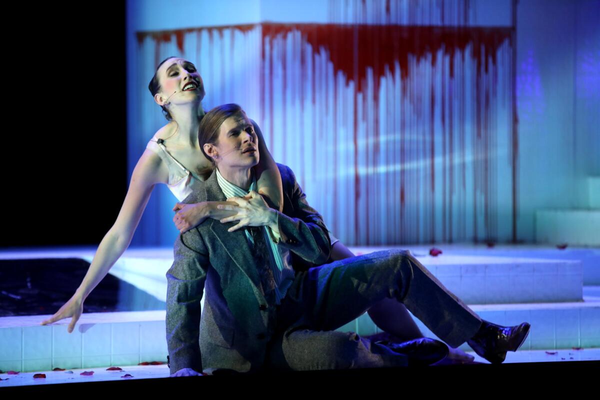 Lucas Steele as The Dreamer and Anna Schubert as Lady Reason during a dress rehearsal of Kate Soper's "Romance of the Rose."