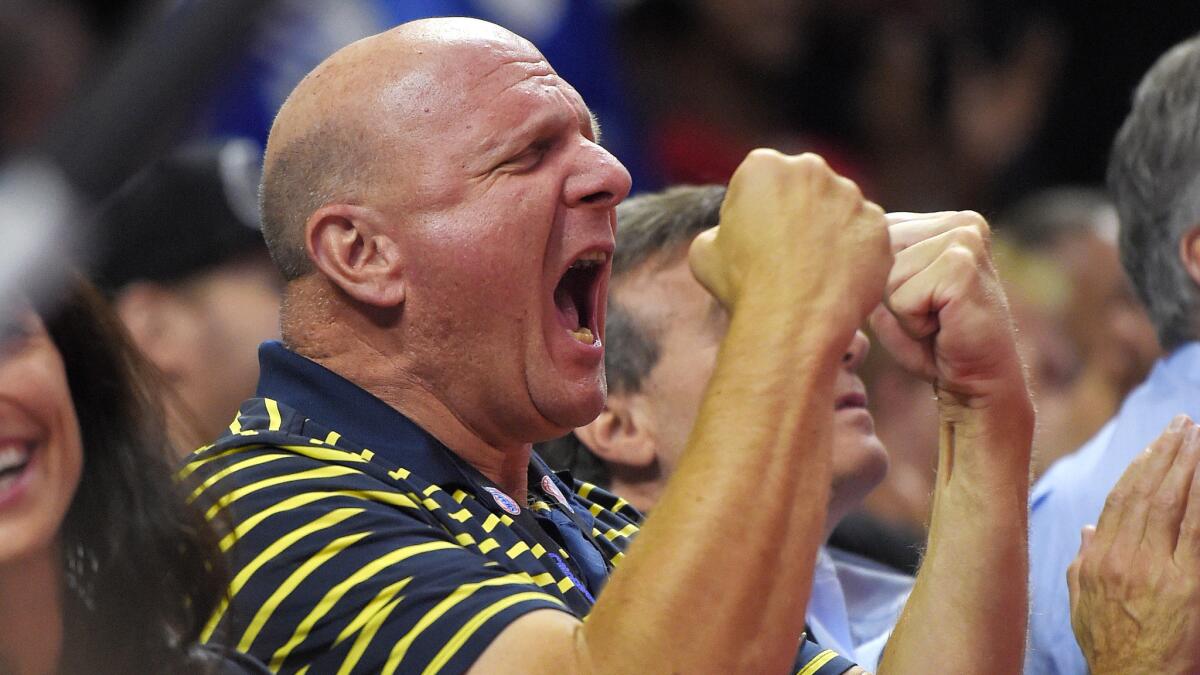Clippers owner Steve Ballmer celebrates during a preseason victory over the Phoenix Suns at Staples Center on Oct. 22, 2014.