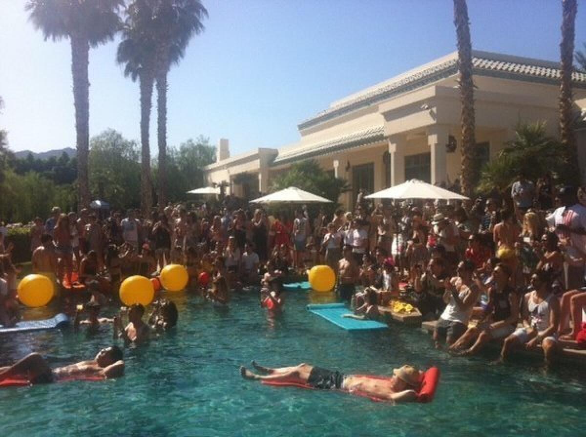 H&M; sponsors one of Coachella's daytime parties at the Merv Griffin estate, featuring a poolside performance by Santigold.