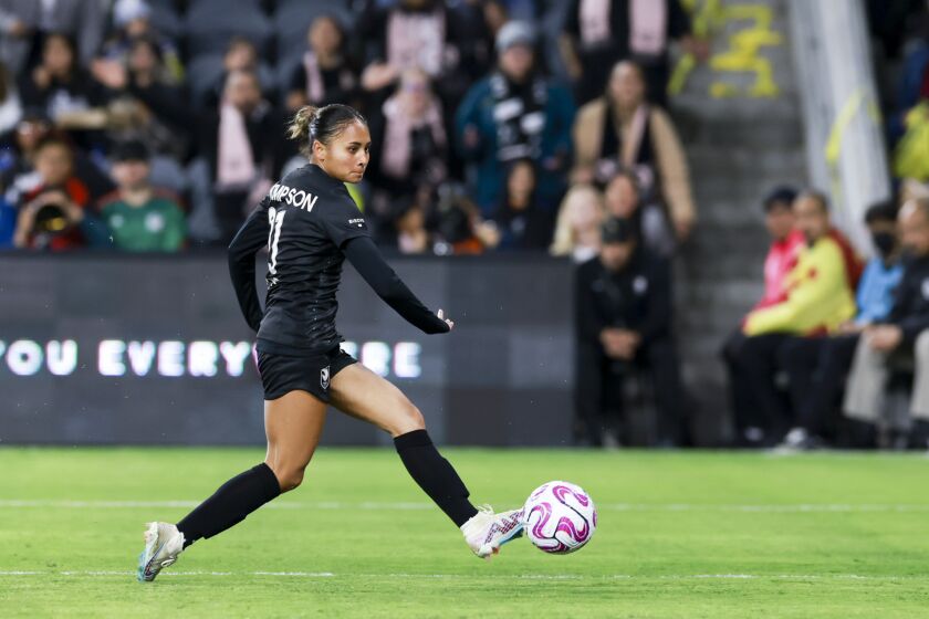 Angel City Football Club forward Alyssa Thompson passes the ball during the first half against Club America at BMO Stadium in Los Angeles, on Wednesday March 8, 2023.