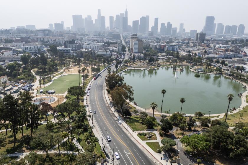 LOS ANGELES, CA - JULY 09: The first phase of the "Reconnecting MacArthur Park" project was announced at MacArthur Park in Los Angeles, CA on Tuesday, July 9, 2024. This first phase will study the feasibility of permanently closing Wilshire Boulevard (pictured), which splits the park, to vehicular traffic in favor of an "open streets" concept. (Myung J. Chun / Los Angeles Times)