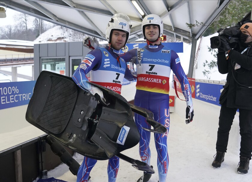 Zachary Di Gregorio and Sean Hollander of United States after their second run at the Luge World Cup men doubles race in Sigulda, Latvia, Saturday, Jan. 8, 2022. (AP Photo/Roman Koksarov)