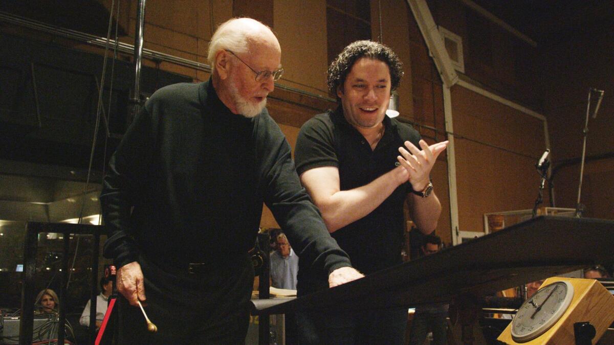 Composer John Williams, left, confers with conductor Gustavo Dudamel about the score for "Star Wars: The Force Awakens," on Oct. 12 at Sony Picture Studios in Culver City.