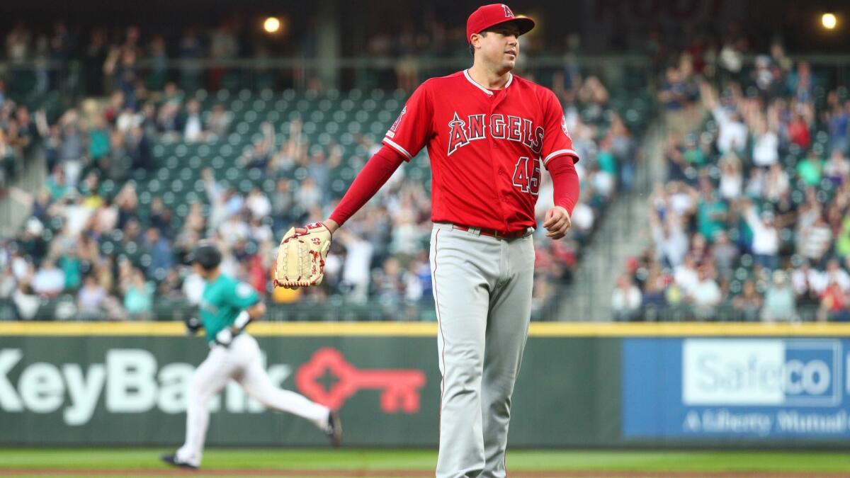 Angels pitcher Tyler Skaggs reacts after giving up a two-run home run to Seattle Mariners' Tom Murphy in the fifth inning on Friday in Seattle.