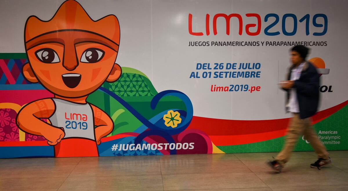 A man walks by a big poster depicting Milco -the official mascot of the Lima 2019 Pan-American Games- in Lima, on July 22, 2019. - The 2019 Pan American Games will take place from July 26 to August 11. (Photo by Luis ROBAYO / AFP)LUIS ROBAYO/AFP/Getty Images ** OUTS - ELSENT, FPG, CM - OUTS * NM, PH, VA if sourced by CT, LA or MoD **