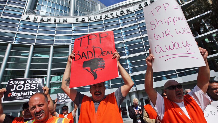 The United Brotherhood of Carpenters and Joiners rallies against Obama's trade proposal in front of the California Democratic Convention in Anaheim on Saturday.