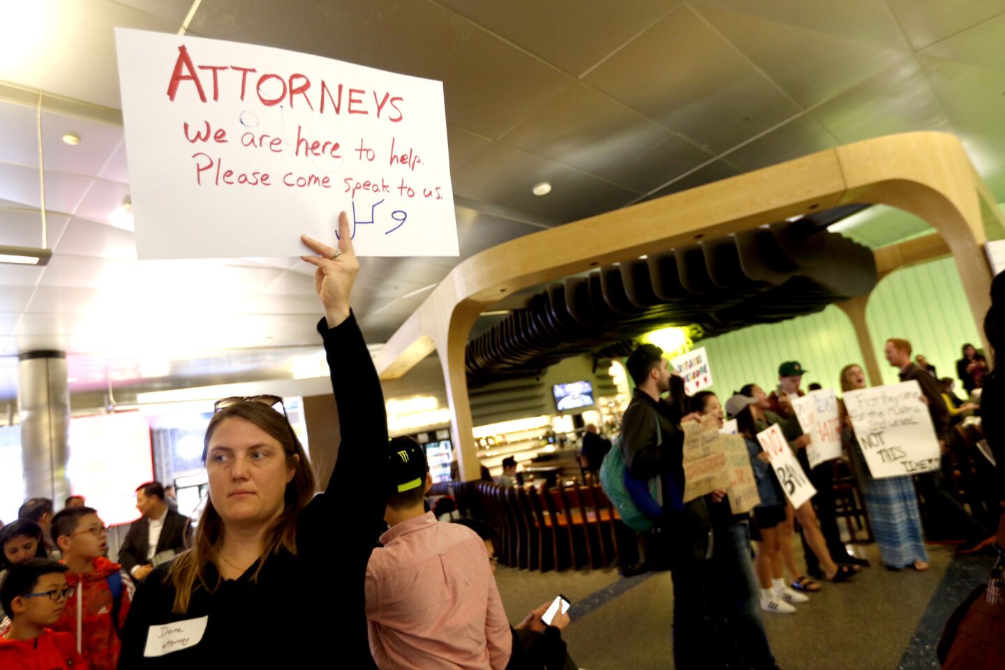 Attorney Dana Clausen waits on Sunday to help at the Tom Bradley International Terminal at LAX as people continue to protest President Trump’s executive order that led to travelers from several majority-Muslim countries being detained upon arrival.