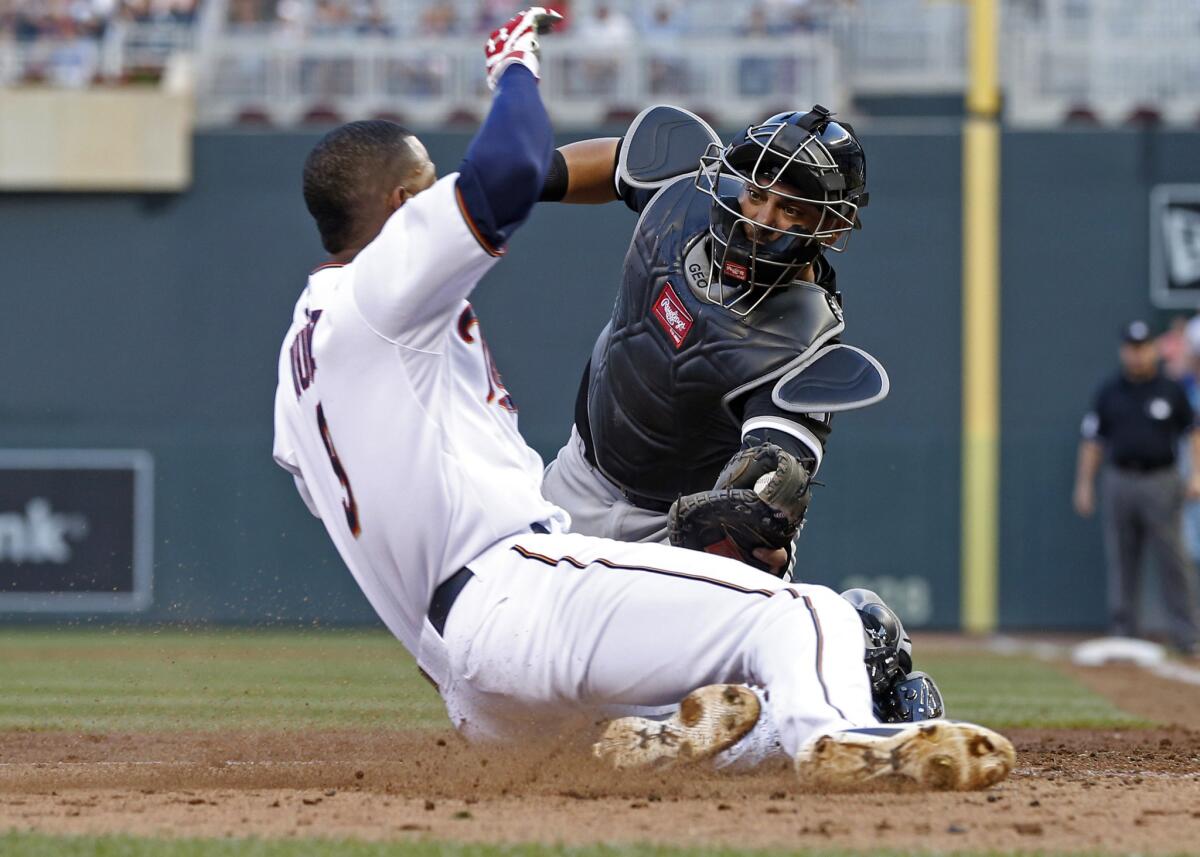 Chicago White Sox catcher Geovany Soto tags out Minnesota Twins infielder Eduardo Nunez, left, during a game on June 23.