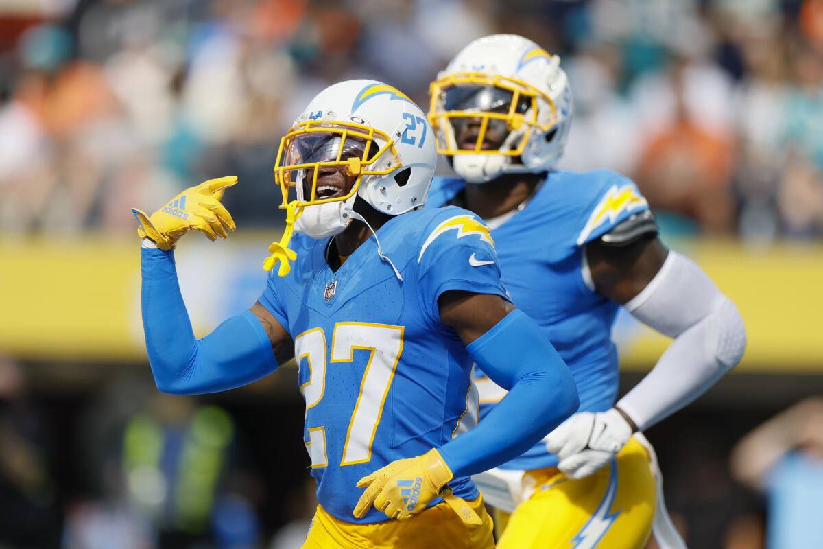 Chargers cornerback J.C. Jackson (27) celebrates after intercepting a pass thrown by the Dolphins' Tua Tagovailoa.