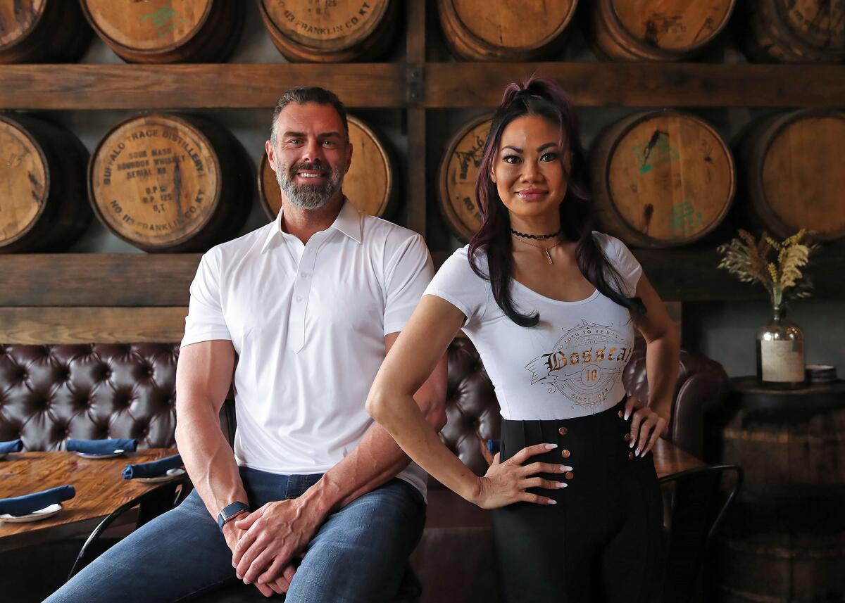 Founders John Reed and Leslie Nguyen in the dining room of the new Bosscat Kitchen & Libations in Irvine. 
