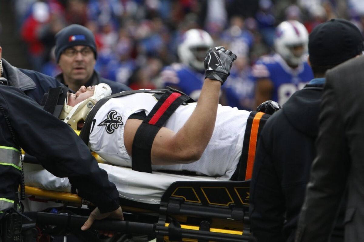 Saints running back Daniel Lasco is carted off the field during the first half of a game against the Bills on Nov. 12.