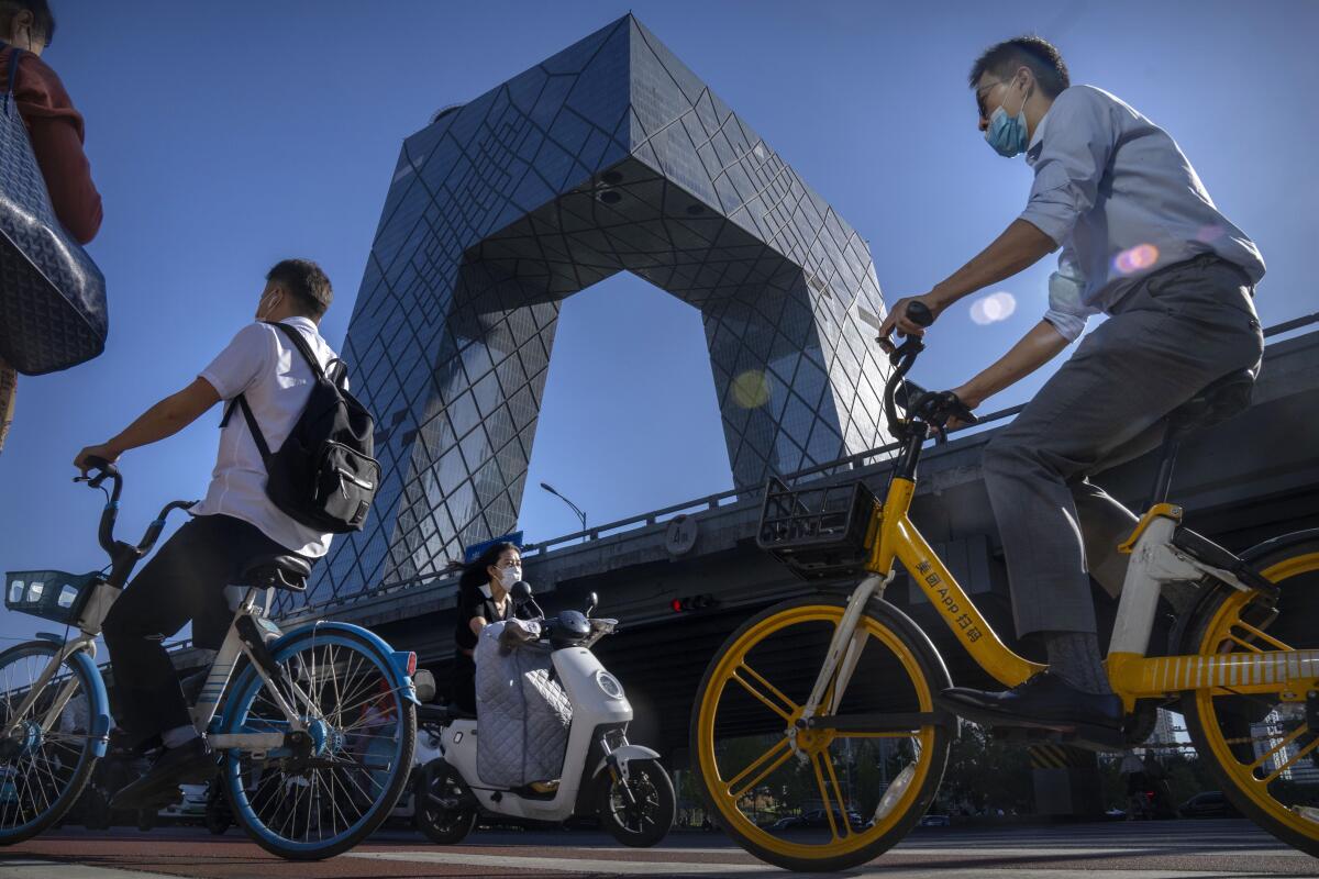 Commuters on bikes in Beijing's central business district