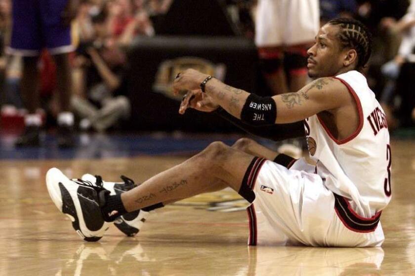 Gina Ferazzi –– – 031388.SP.0613.lakers11.GF– Allen Iverson gets himself off the court in the third quarter during Game 4 of the NBA Finals in Philadelphia on Sunday. (Gina Ferazzi/LAT)