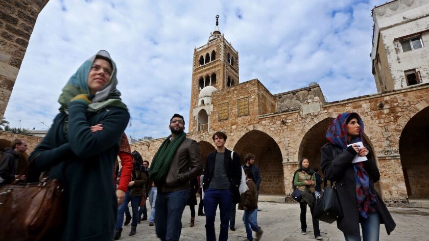 Tourists visit the Mansouri Great Mosque in Tripoli, Lebanon, in 2015.