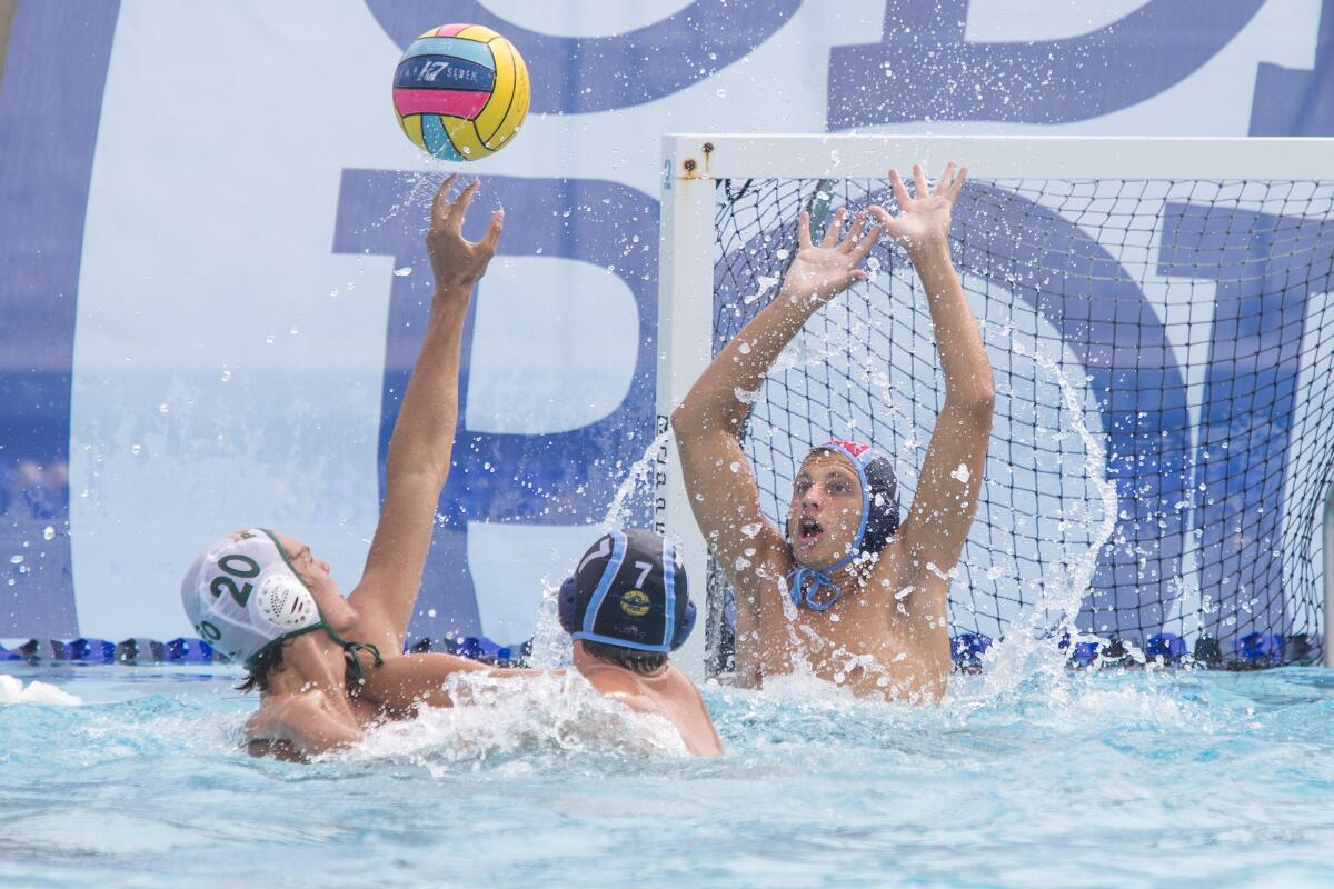 Corona del Mar goalkeeper Harrison Smith blocks a shot by Riverside Poly during a nonleague match on Saturday.