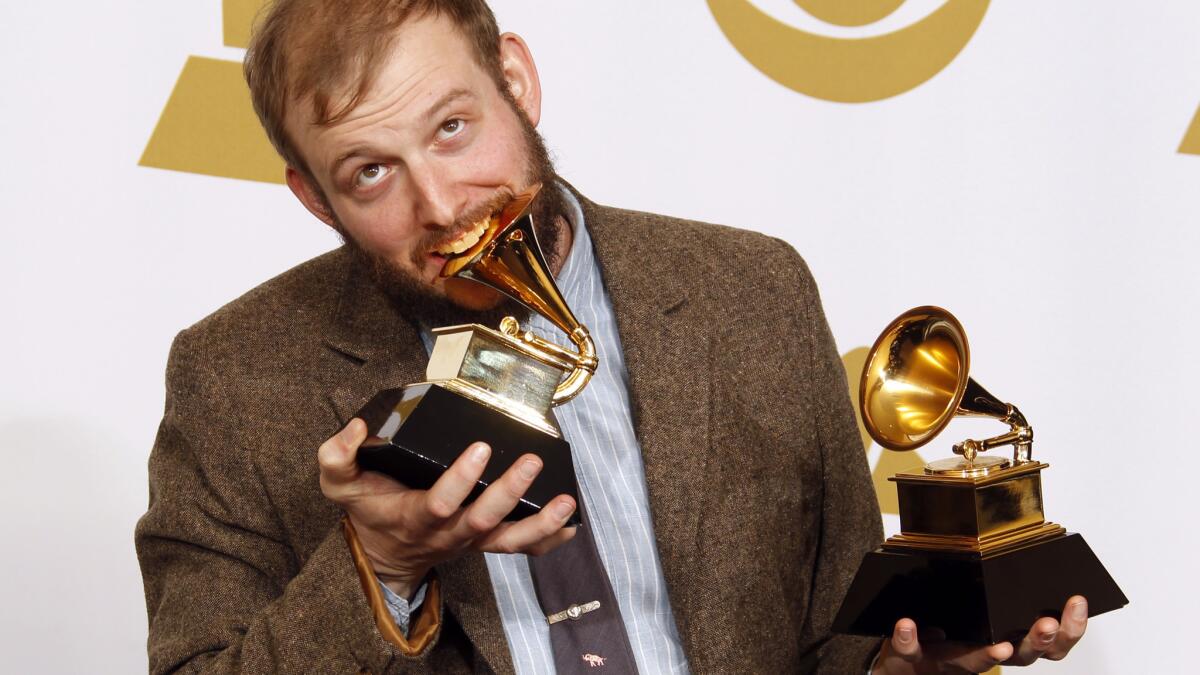 Bon Iver frontman Justin Vernon with his two Grammys in 2012 for a self-titled album. His latest album is "22, a Million."