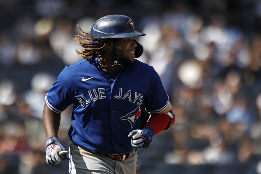 Toronto Blue Jays' Vladimir Guerrero Jr. smiles after hitting a single against the New York Yankees during the eighth inning of a baseball game on Monday, Sept. 6, 2021, in New York. (AP Photo/Adam Hunger)