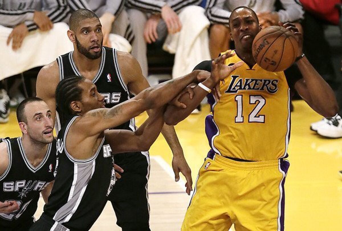 Lakers center Dwight Howard is fouled by Spurs forward Kawhi Leonard in first half of Game 3 on Friday night at Staples Center.