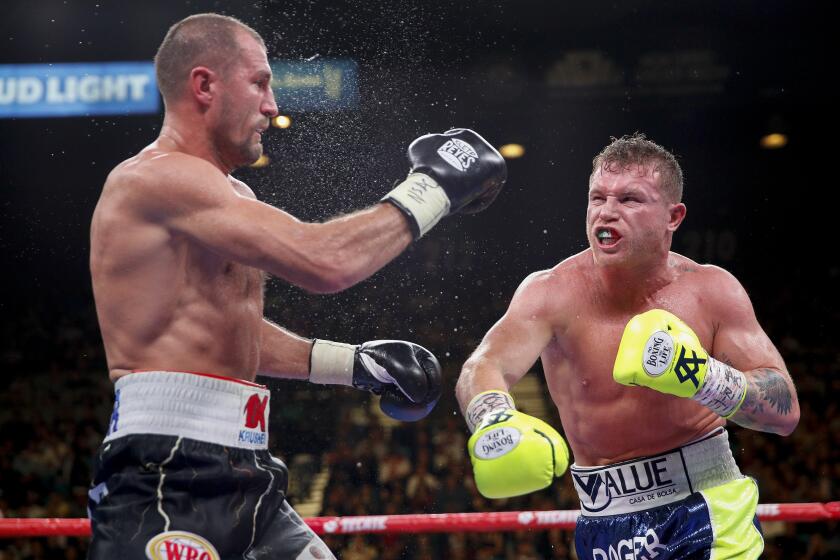 Sergey Kovalev, left, and Canelo Alvarez exchange punches during a light heavyweight WBO title bout, Saturday, Nov. 2, 2019, in Las Vegas (AP Photo/John Locher)