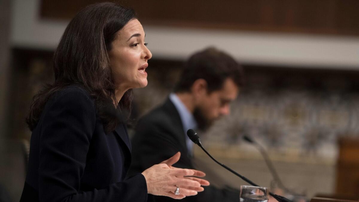 Facebook Chief Operating Officer Sheryl Sandberg and Twitter Chief Executive Jack Dorsey testify before the Senate Intelligence Committee on Capitol Hill on Wednesday.