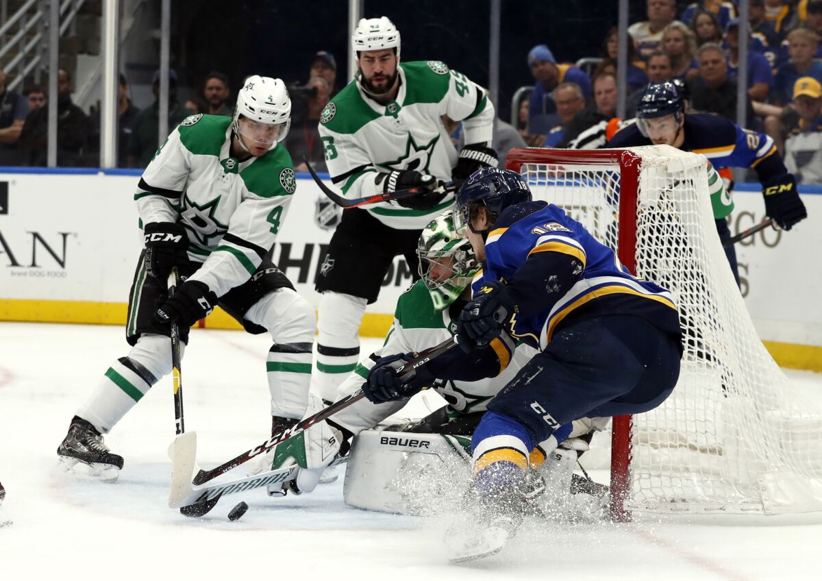 St. Louis Blues' Robert Thomas, right, is unable to score past Dallas Stars goaltender Ben Bishop, Miro Heiskanen (4) and Valeri Nichushkin (43) during the second period in Game 2 of an NHL second-round playoff series on Saturday.