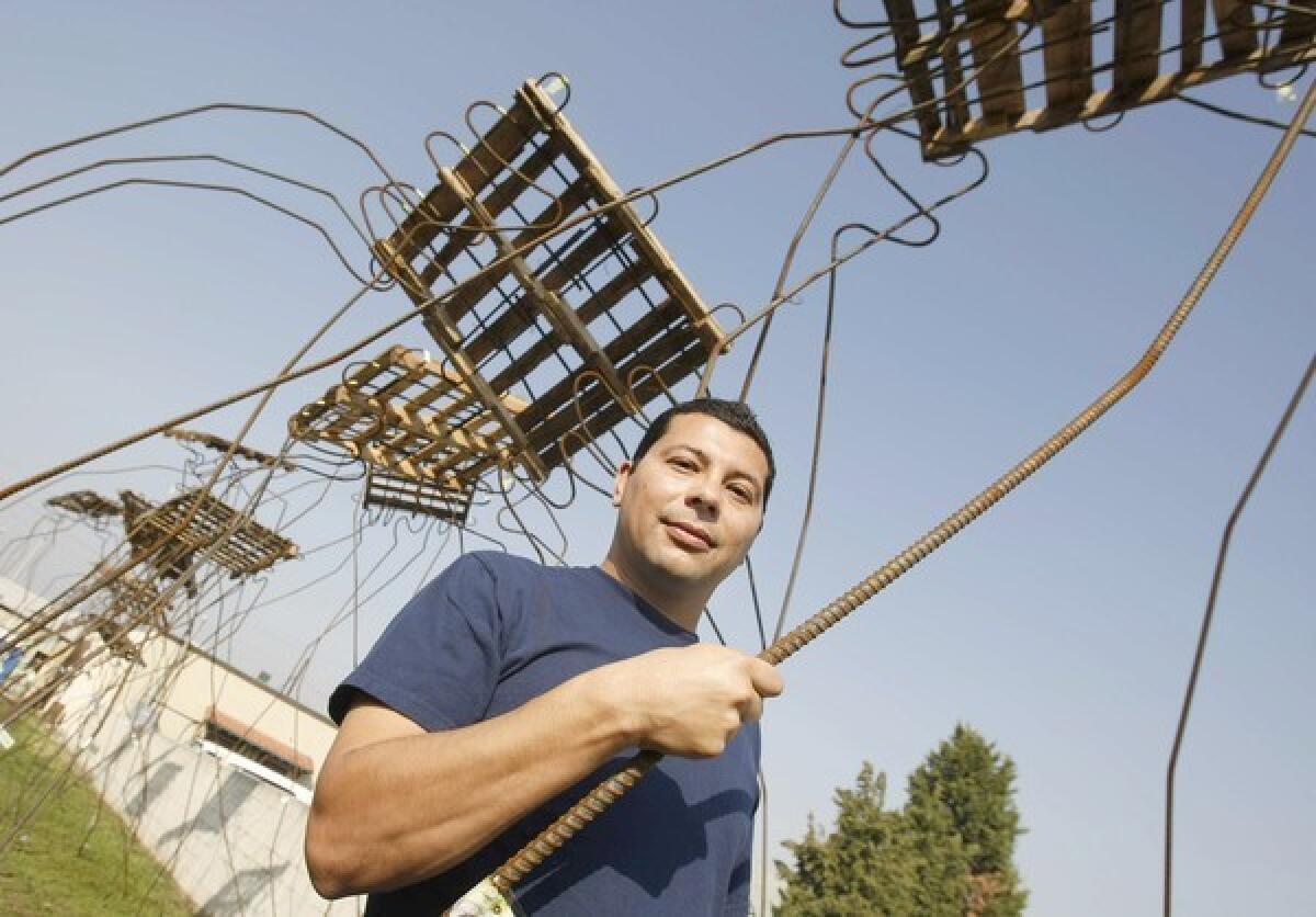 Outside his studio, Ruben Ochoa stands by a piece created for a solo show at San Diego's Museum of Contemporary Art.