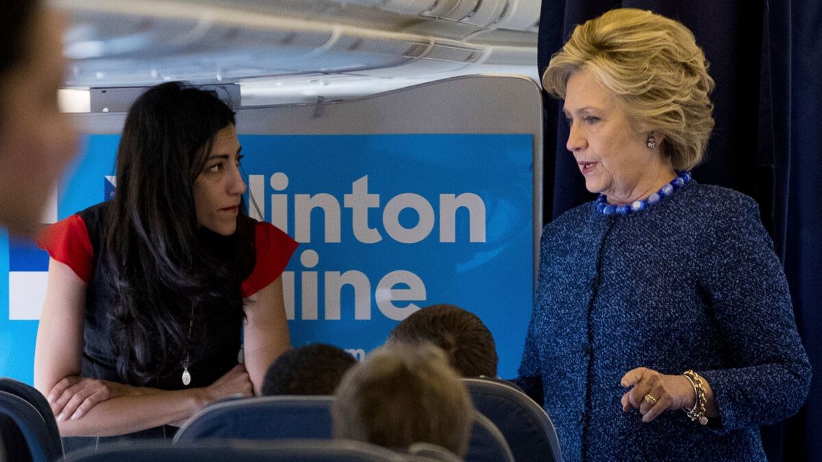Hillary Clinton and Huma Abedin onboard the campaign plane.
