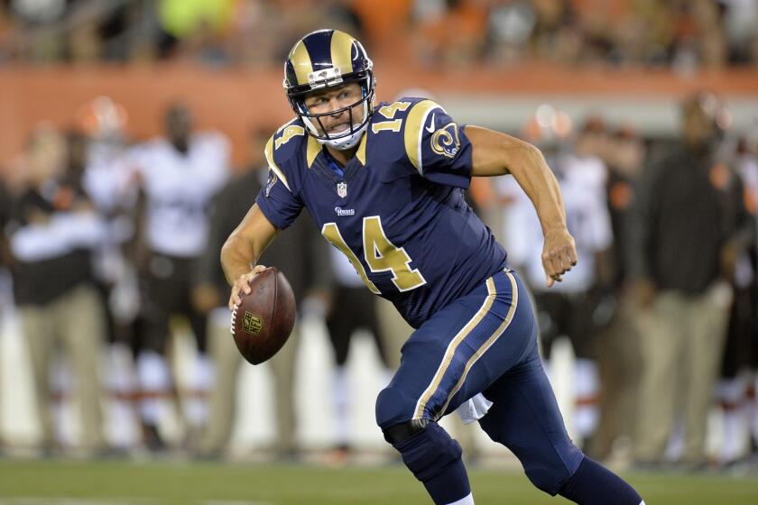 St. Louis Rams quarterback Shaun Hill scrambles away from the Cleveland Browns defense in the second quarter of a preseason game Saturday. Hill completed two of six passing attempts for 45 yards in the 33-14 win over the Browns.