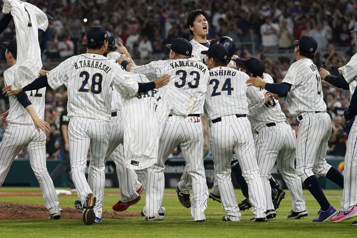 Japan pitcher Shohei Ohtani  celebrates after defeating the U.S. at the World Baseball Classic final.