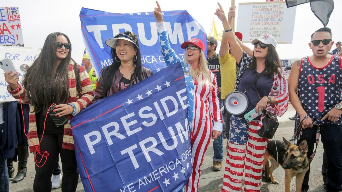 Supporters of President Trump hold a rally in San Diego on March 13.