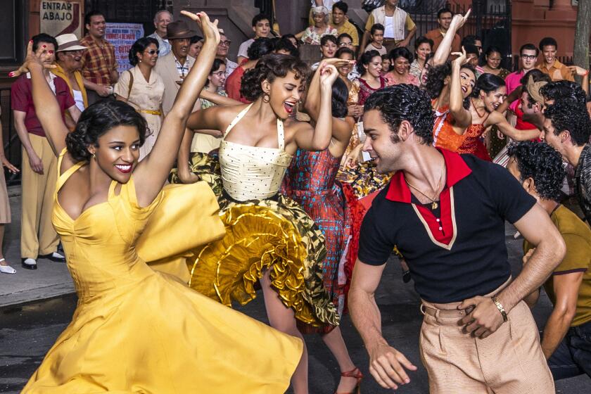 Ariana DeBose as Anita and David Alvarez as Bernardo in 20th Century Studios' WEST SIDE STORY. Photo by Niko Tavernise. © 2021 20th Century Studios. All Rights Reserved.