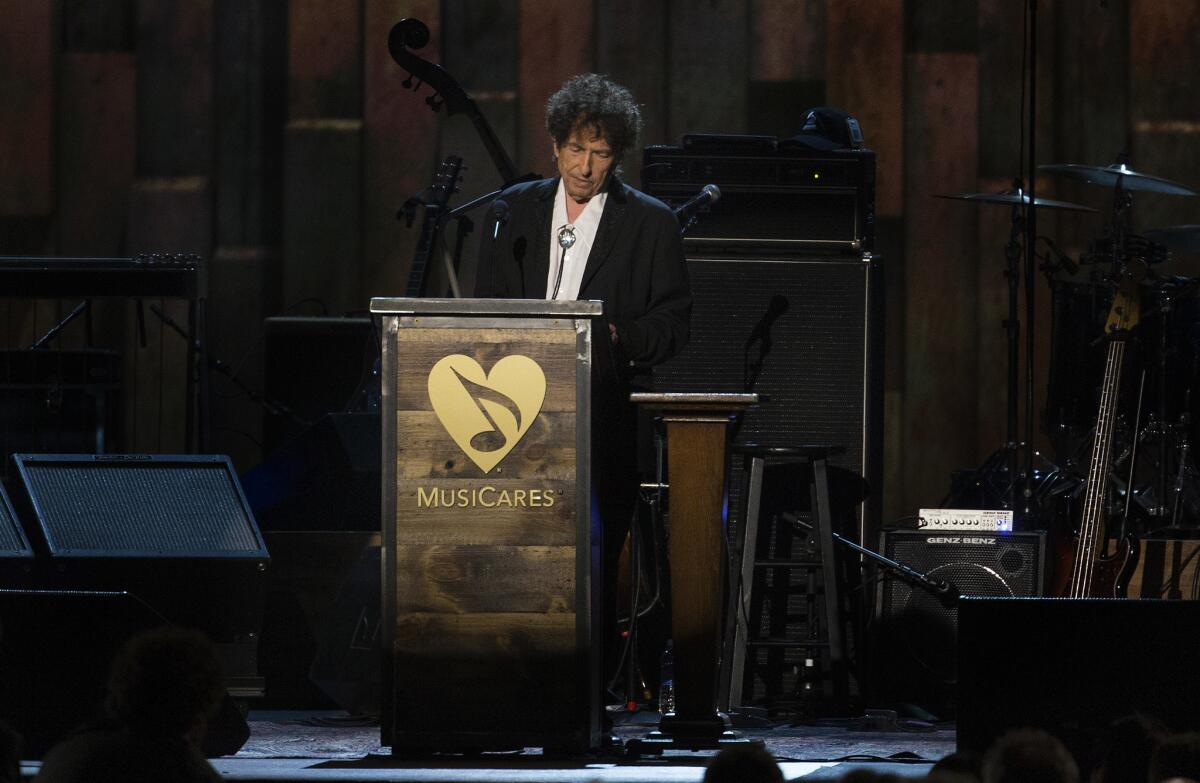 Bob Dylan, the 2015 MusiCares Person of the Year, speaks of his life and music to the crowd during the MusiCares concert at the Convention Center on Feb. 6, 2015, in Los Angeles.