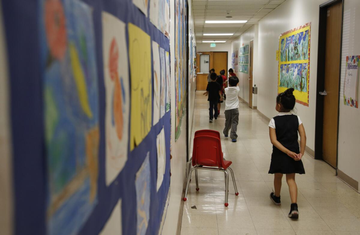 Students walk down a hallway at Metro Charter Elementary School in downtown Los Angeles.
