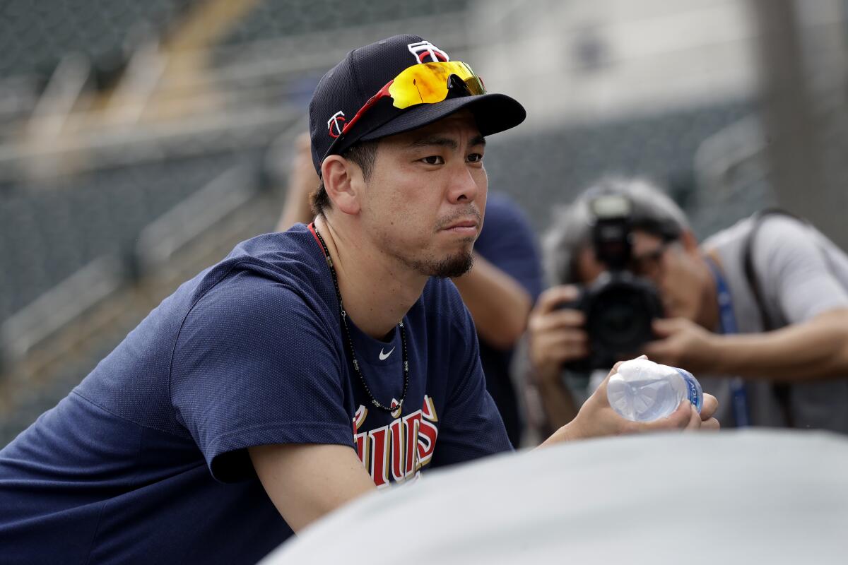 Twins starting pitcher Kenta Maeda (18) watches pitchers throw during a spring training practice Feb. 16 in Fort Myers, Fla.