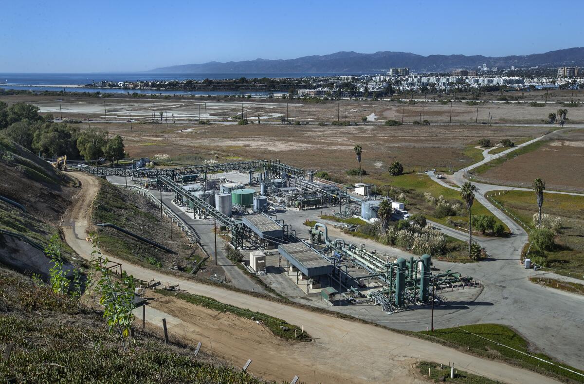 An industrial compound next to wetlands.