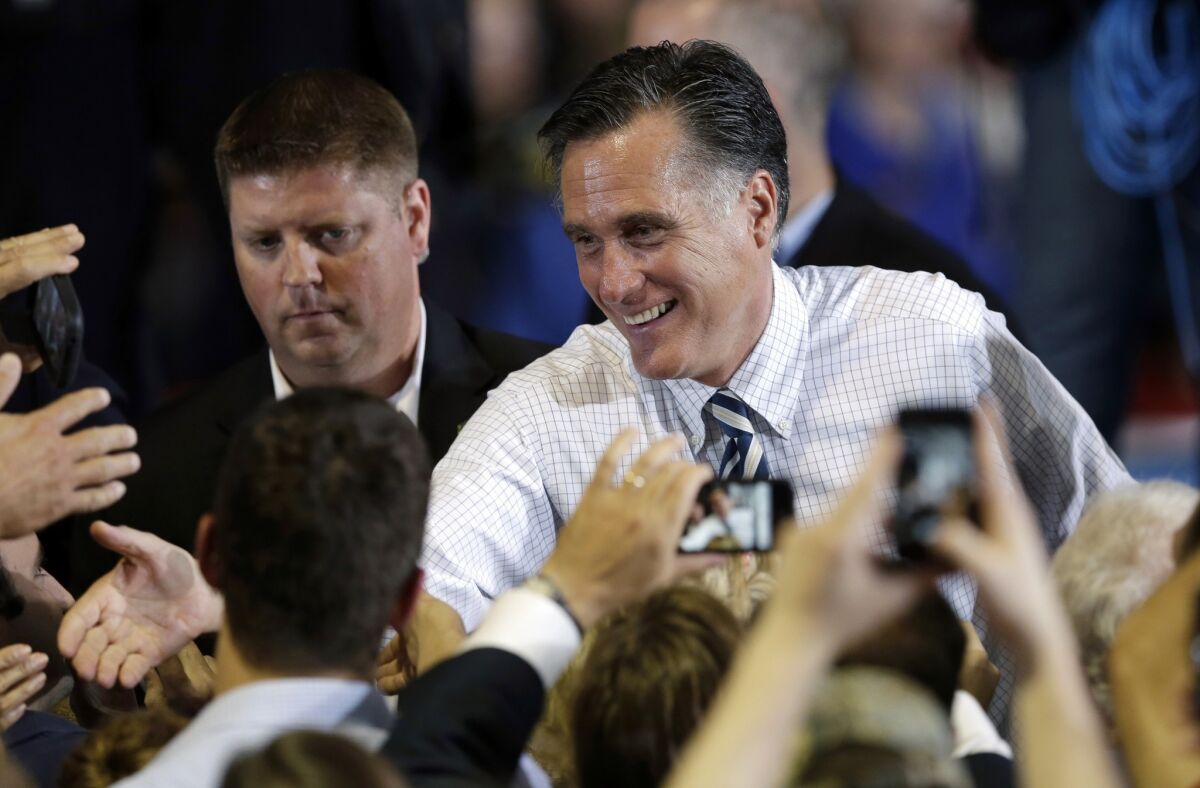 Republican presidential candidate and former Massachusetts Gov. Mitt Romney greets supporters during a campaign stop, Wednesday, Oct. 24, 2012, at the Eastern Iowa Airport in Cedar Rapids, Iowa.