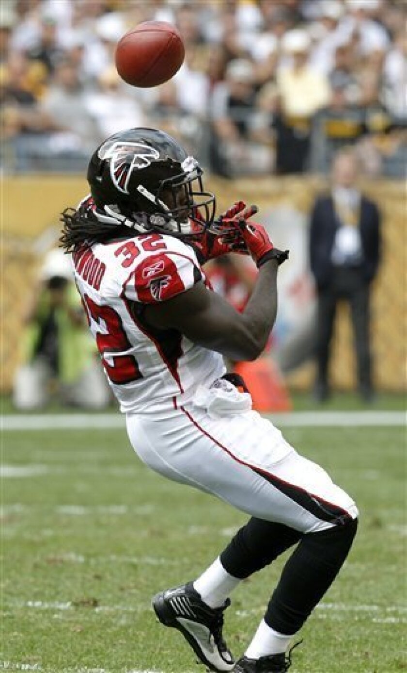 A pass bounces off Atlanta Falcons running back Jerious Norwood (32) in the second quarter of the NFL football game against the Pittsburgh Steelers in Pittsburgh, Sunday, Sept. 12, 2010. (AP Photo/Keith Srakocic)