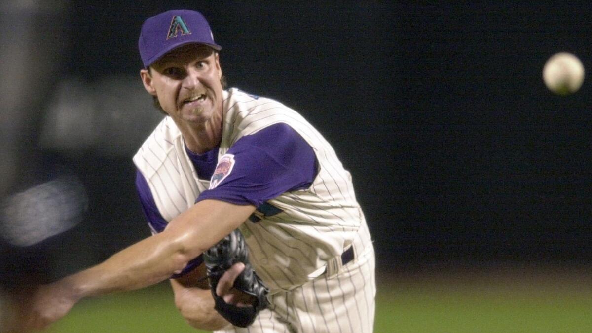 Arizona Diamondbacks pitcher Randy Johnson delivers a pitch during Game 6 of the 2001 World Series against the New York Yankees. Johnson was elected to the Baseball Hall of Fame on Tuesday.