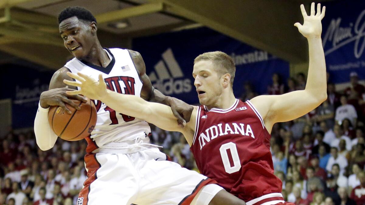 UNLV forward Dwayne Morgan pulls down a rebound against Indiana forward Max Bielfeldt in the first half Wednesday.