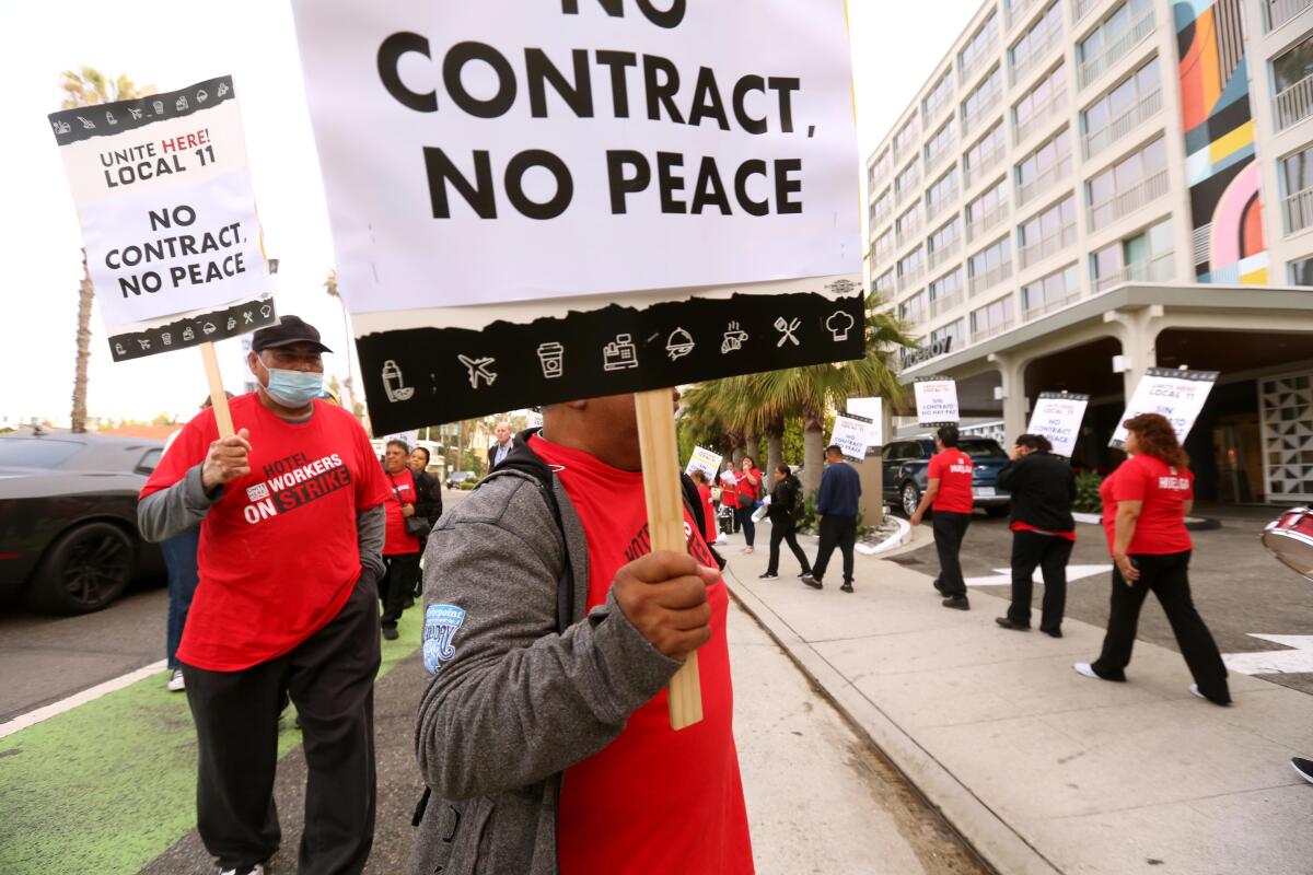 hotel workers picket in front of the Viceroy Hotel in Santa Monica 