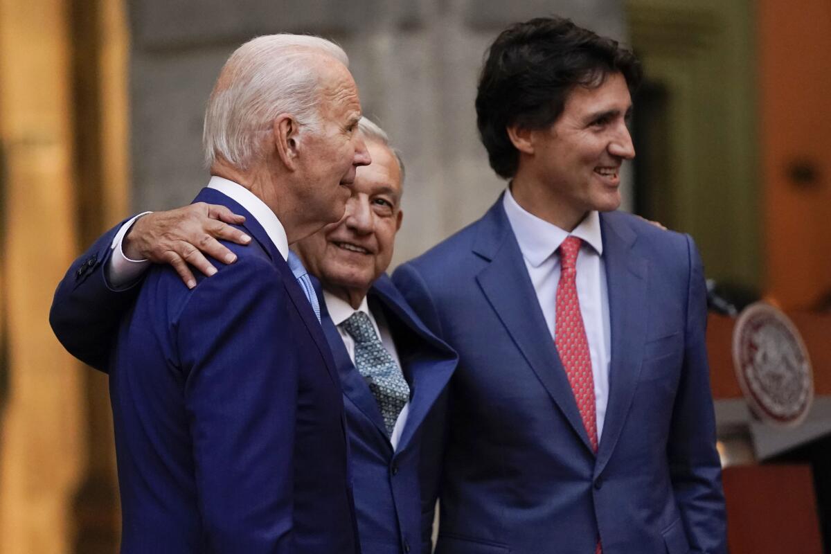 President Joe Biden, Mexican President Andres Manuel Lopez Obrador, and Canadian Prime Minister Justin Trudeau arrive for a news conference at the 10th North American Leaders' Summit at the National Palace in Mexico City, Tuesday, Jan. 10, 2023. (AP Photo/Andrew Harnik)