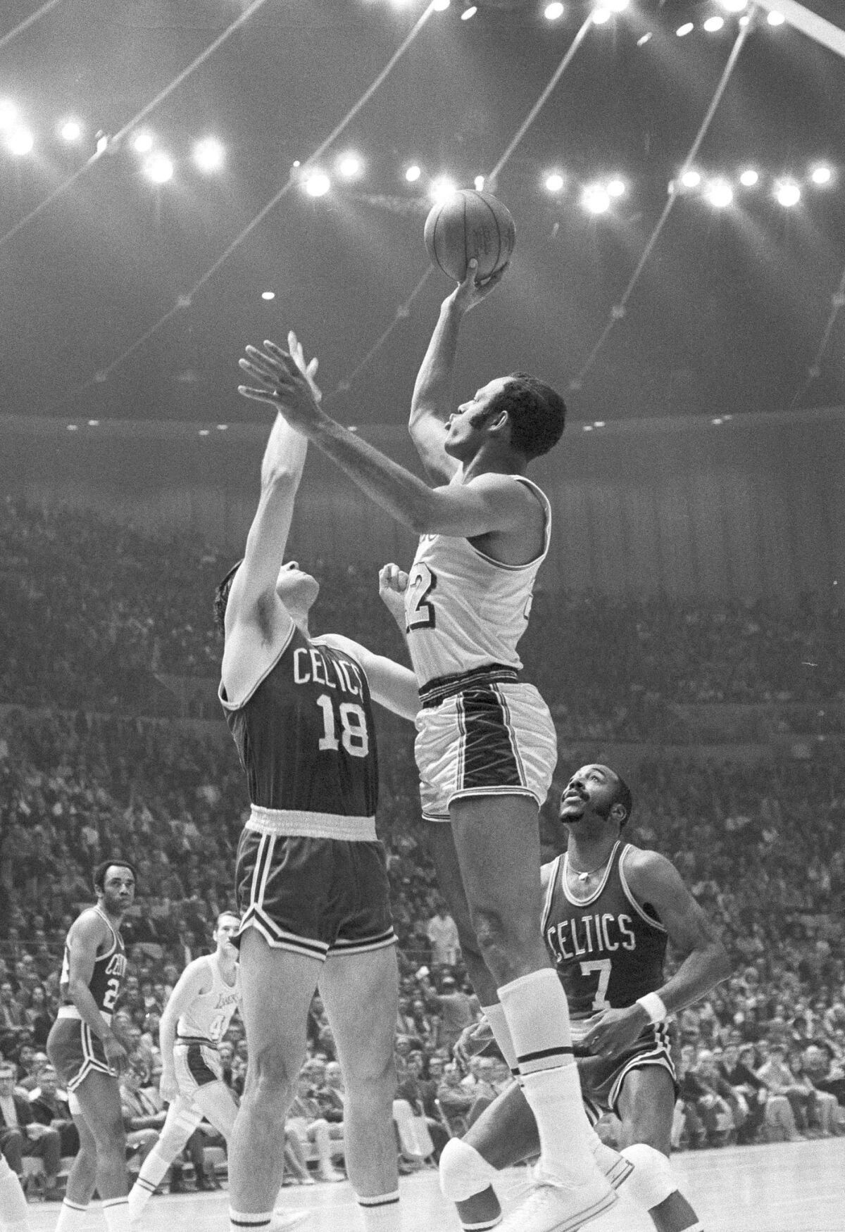 The Lakers' Elgin Baylor fires a jump shot against the Boston Celtics in the seventh and final game of their NBA playoff series at Los Angeles, May 5, 1969.
