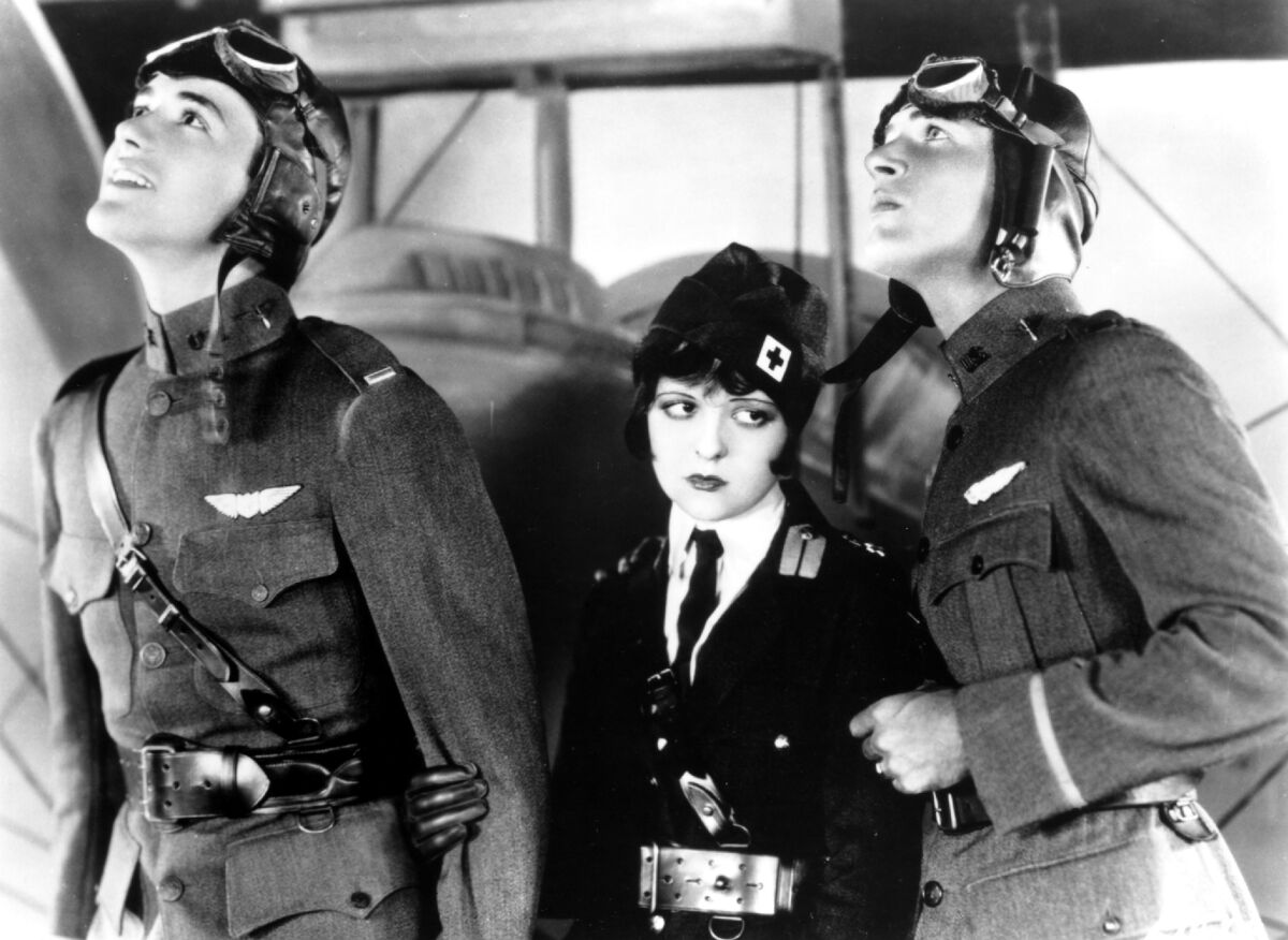 black and white photo of two pilots and one nurse 