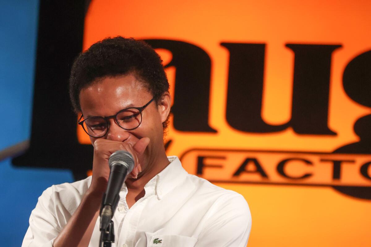 Willie Hunter laughs while hosting a comedy show at the Laugh Factory.