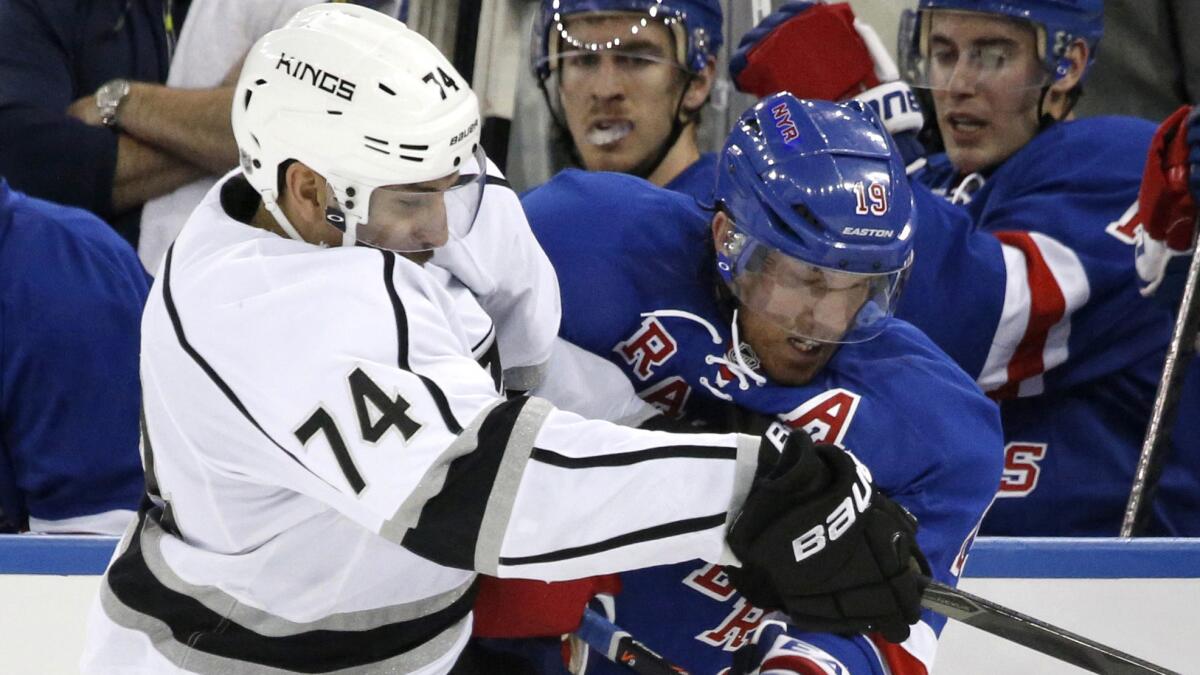 Kings left wing Dwight King, left, checks New York Rangers center Brad Richards during the second period of the Kings' 1-0 win on Nov. 17.