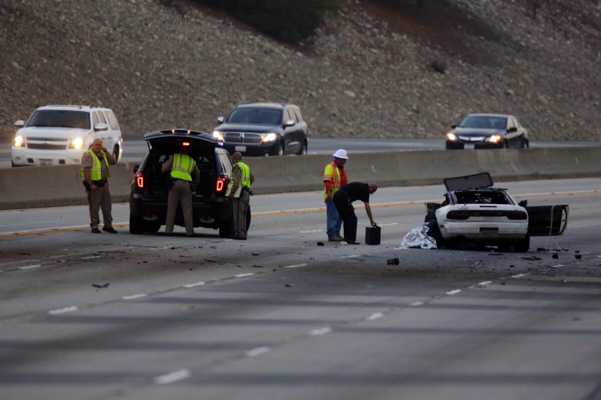 CHP officials investigate a fatal accident caused by a wrong-way driver on the westbound lanes of the 210 Freeway in Azusa.