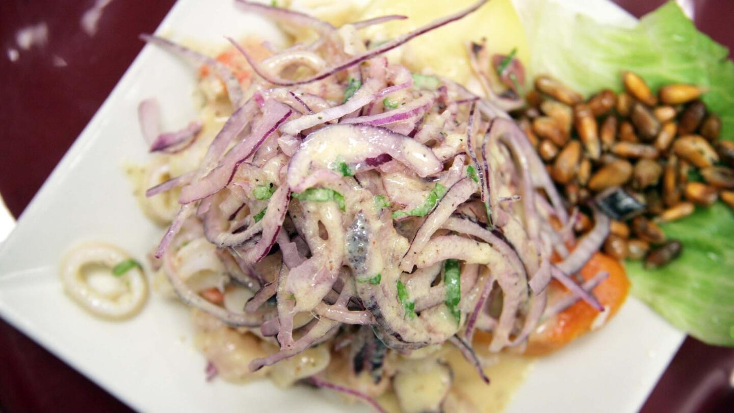 Don't worry. There's plenty of fresh seafood hiding under the pile of onions in the ceviche mixto.
