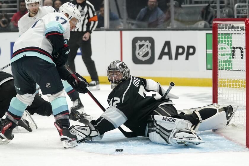 Seattle Kraken center Jaden Schwartz, left, gets ready to score on Los Angeles Kings goaltender Jonathan Quick during the first period of an NHL hockey game Thursday, Oct. 13, 2022, in Los Angeles. (AP Photo/Mark J. Terrill)