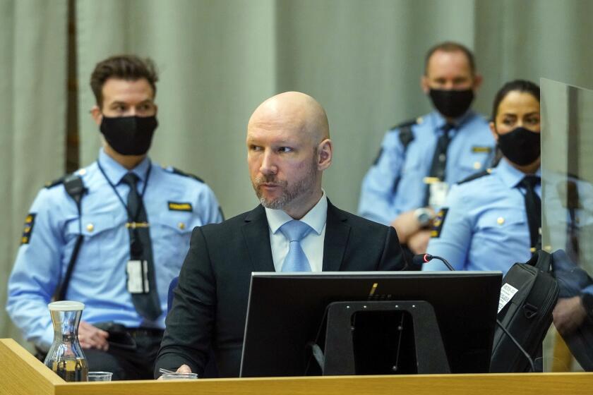 FILE - Convicted mass murderer Anders Behring Breivik sits in the makeshift courtroom in Skien prison on the second day of his hearing where he is requesting release on parole, in Skien, Norway, Jan. 19, 2022. A decade after the 2011 bombing and shooting spree that left 77 dead, Breivik is seeking early release from a 21-year sentence — the maximum term in Norway. (Ole Berg-Rusten/NTB scanpix via AP, File)