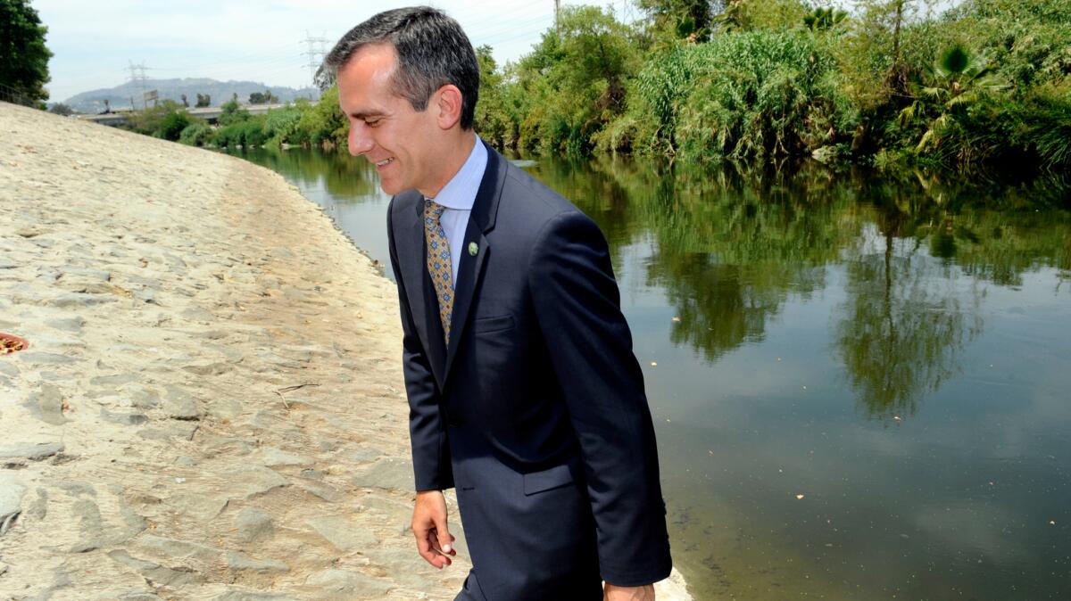 Los Angeles Mayor Eric Garcetti walks along the L.A. River in 2014.